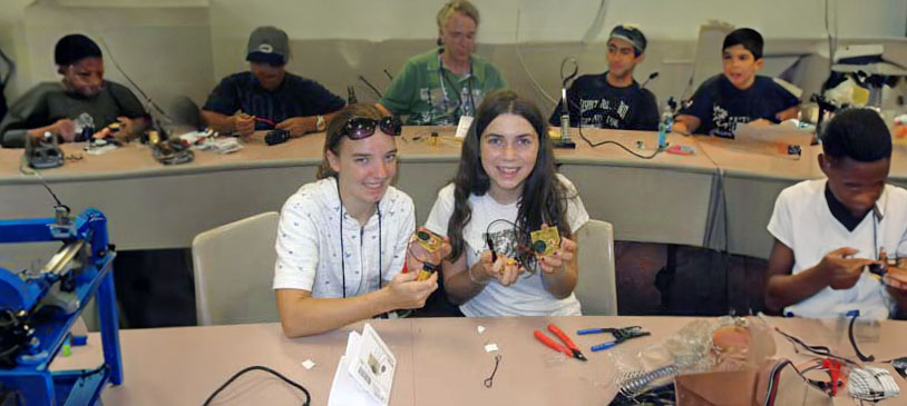 Kids Working On Electronics Kits